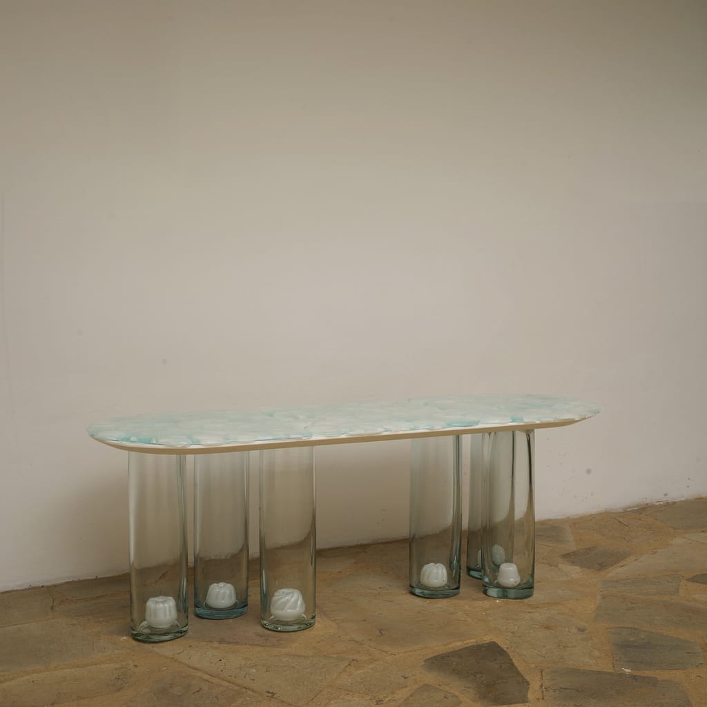 This beautiful handcrafted glass bench is a work of art made by the artist and can also be used as a coffee table.